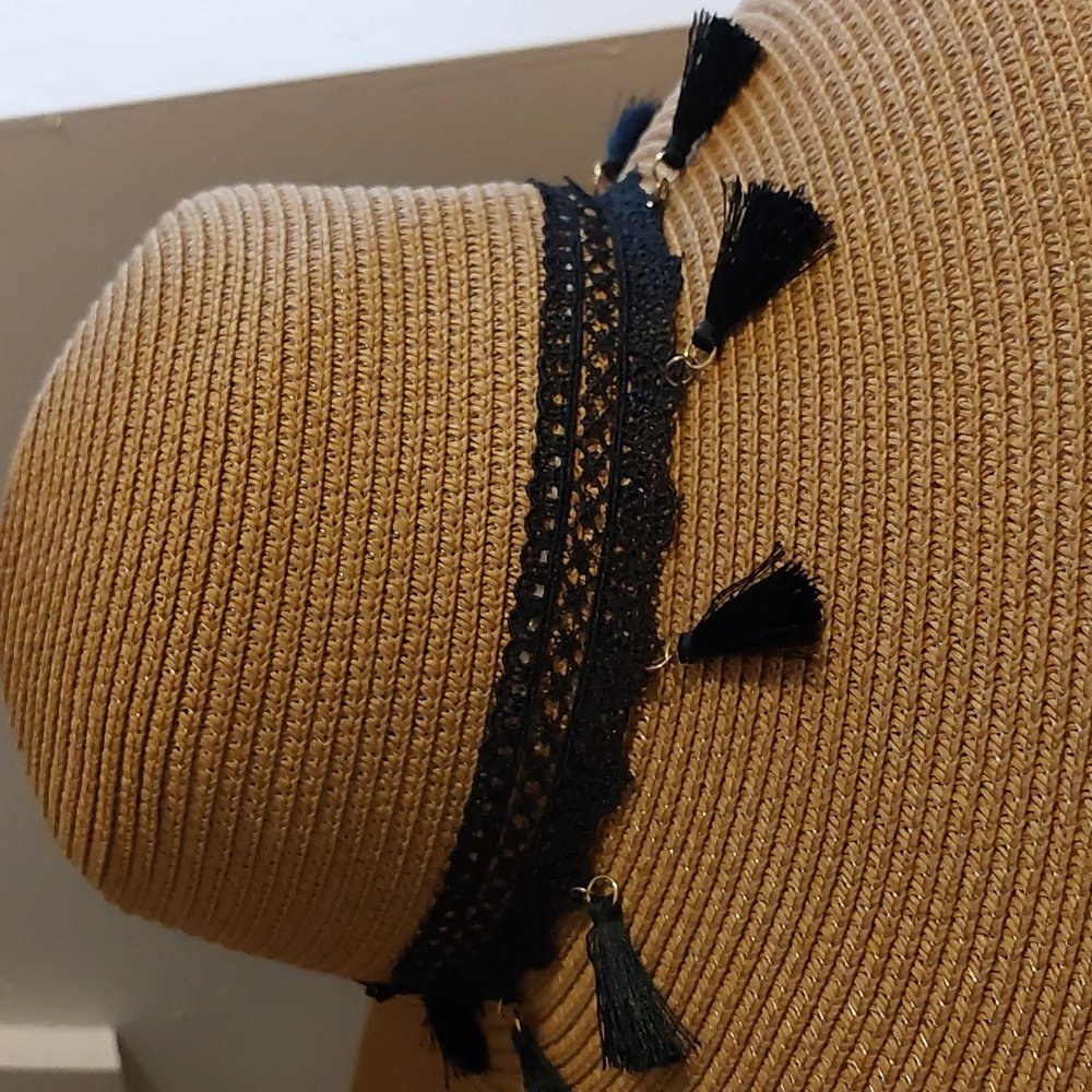 Wide brim Paper Straw Sun hat with black tassels.